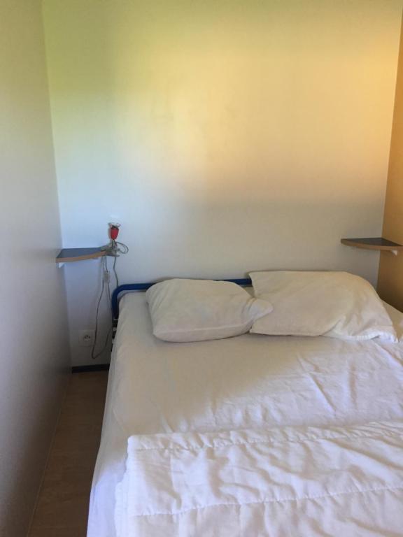 Postel nebo postele na pokoji v ubytování Camping La Prairie