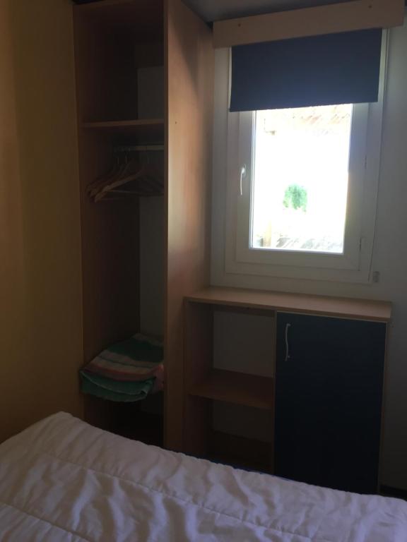 Postel nebo postele na pokoji v ubytování Camping La Prairie