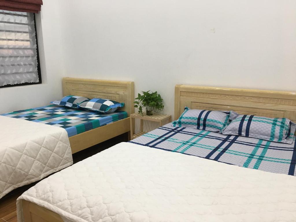 Postel nebo postele na pokoji v ubytování Ken King 2 - homestay gần biển giá rẻ