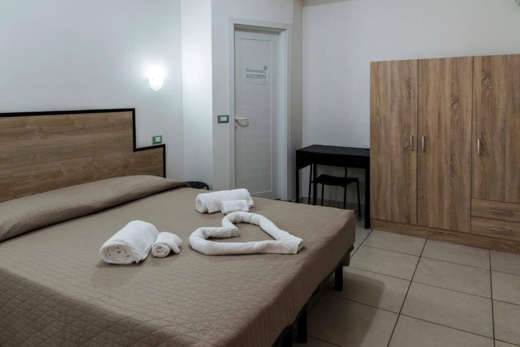 Postel nebo postele na pokoji v ubytování My Hotel Cesenatico
