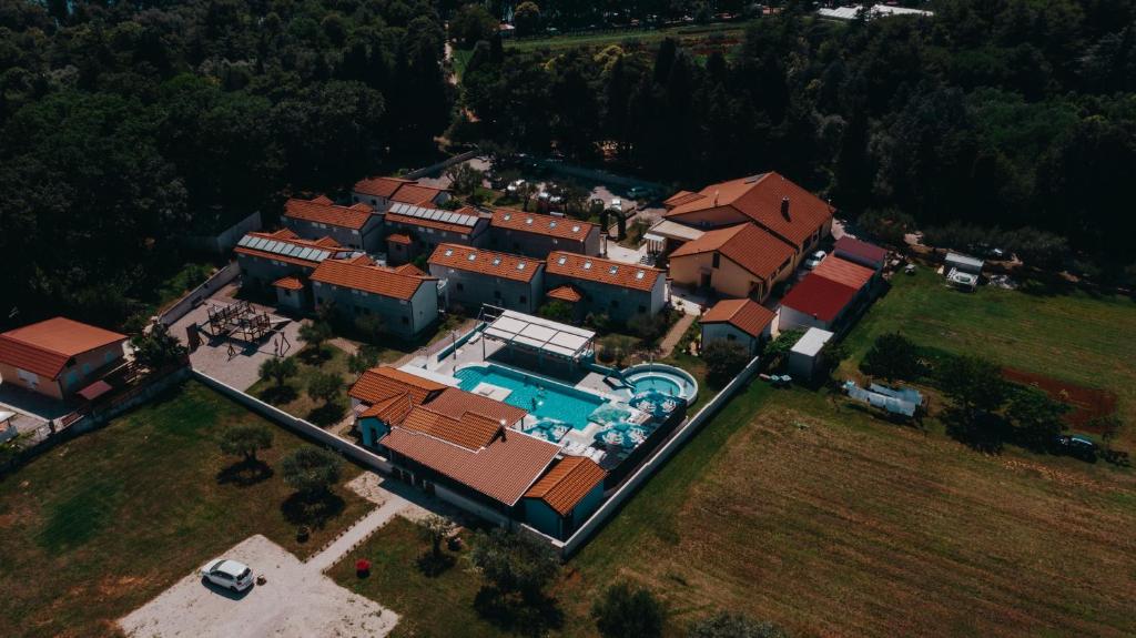 an aerial view of a house with a swimming pool at Resort Zatišje in Savudrija