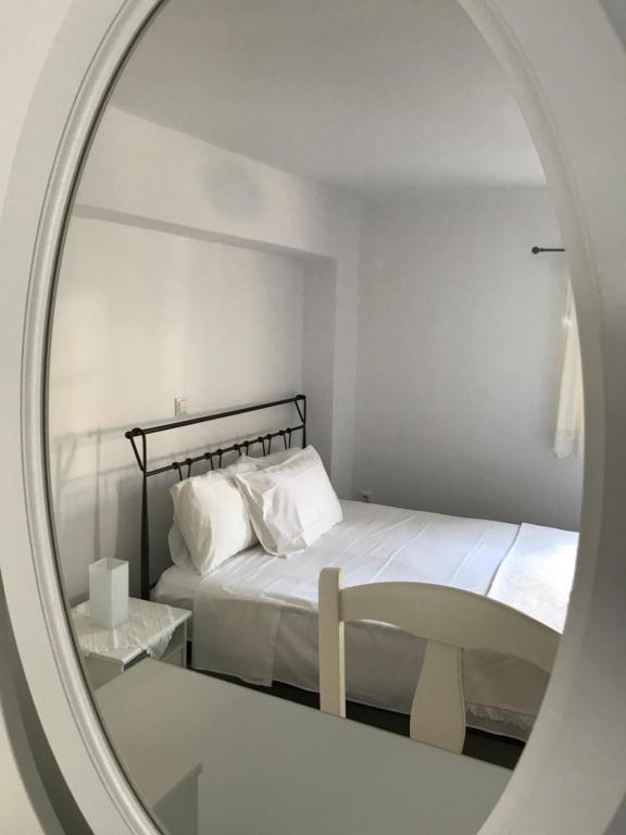 Postel nebo postele na pokoji v ubytování Vegera Apartment 'Ostria', Stavros Donoussa