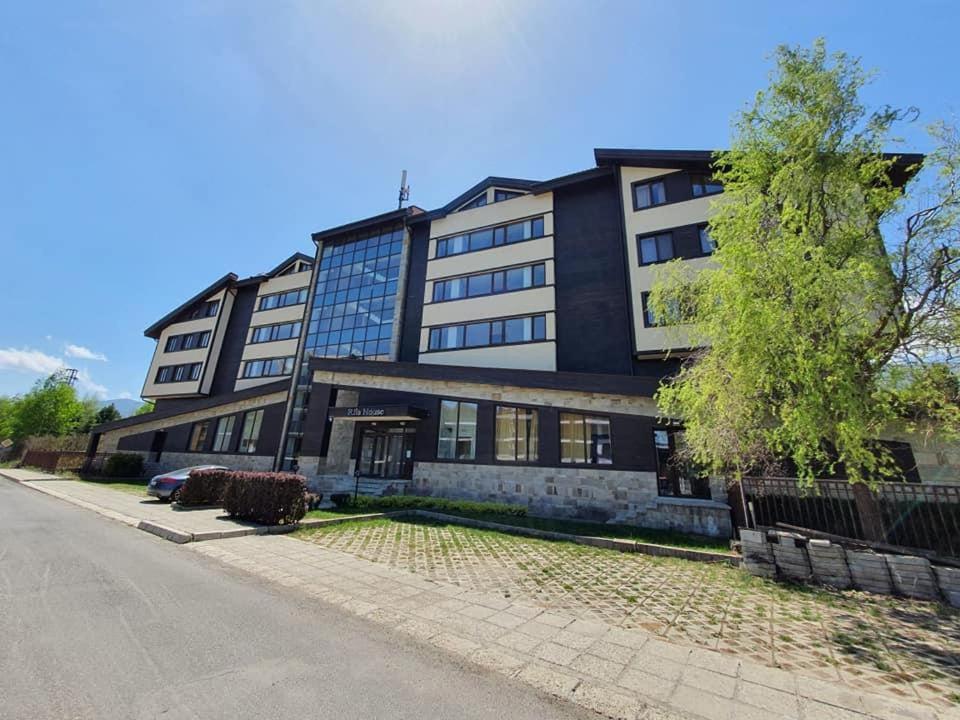a large black building on the side of a street at Sunny duplex with spectacular view in Terra Complex in Razlog