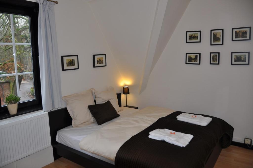 Postel nebo postele na pokoji v ubytování Hotel 'T Bagientje