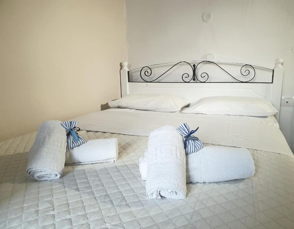 Postel nebo postele na pokoji v ubytování Syros Holidays