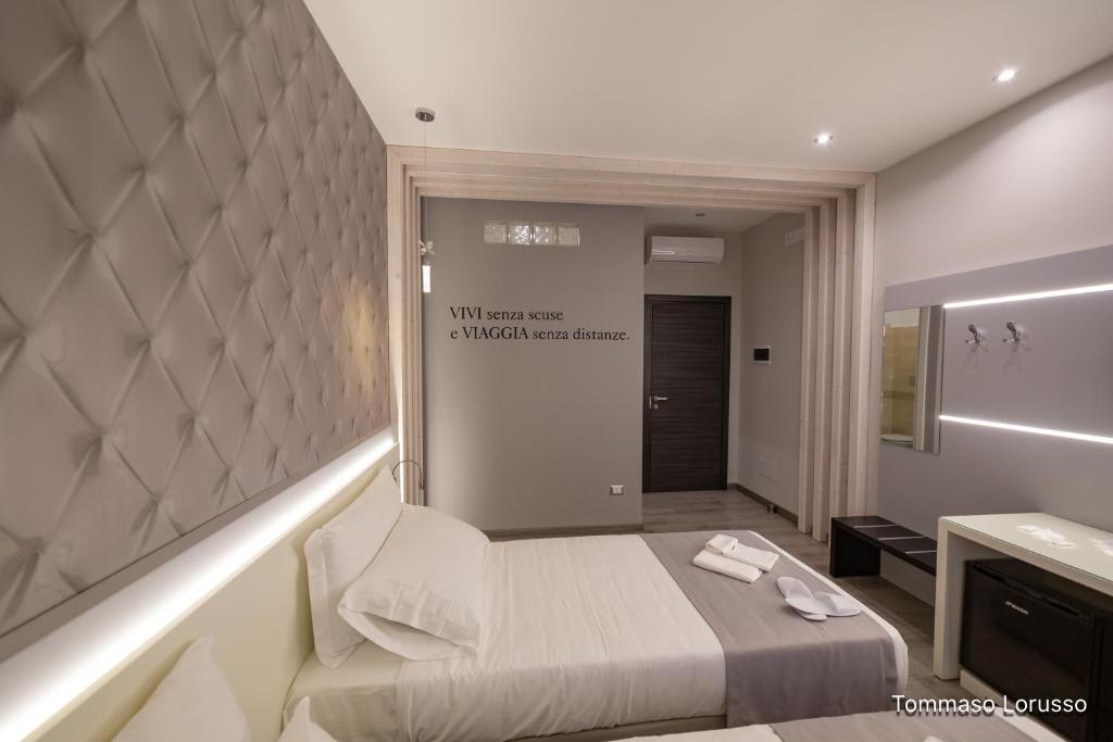 Postel nebo postele na pokoji v ubytování HOLYGOLD Suite ****