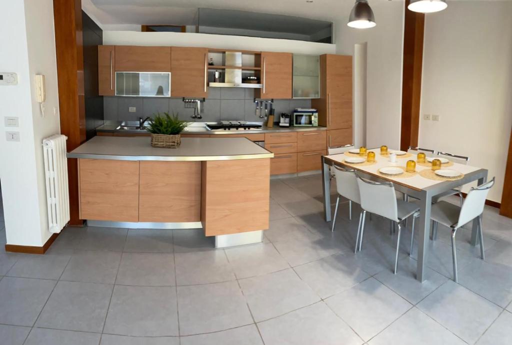 a large kitchen with a table and chairs in it at Borgo antico - FronteMare in Giovinazzo