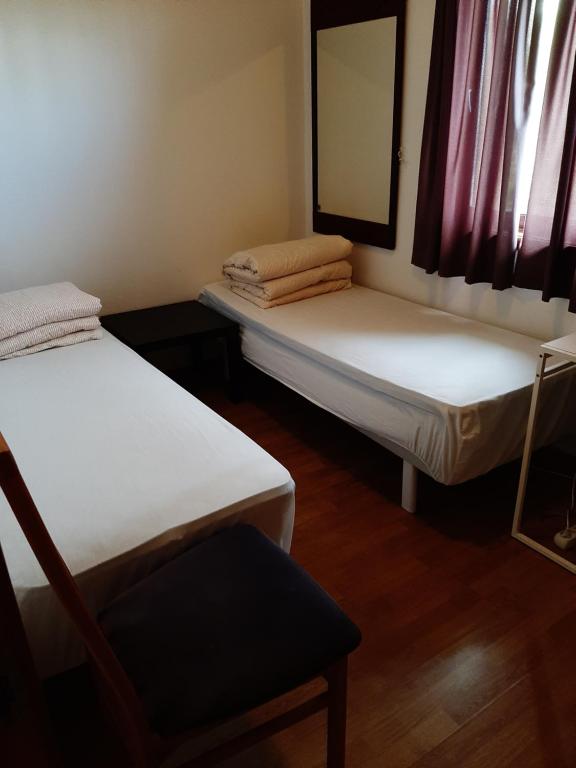 Postel nebo postele na pokoji v ubytování Gardenview Room