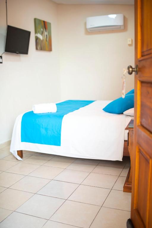 Postel nebo postele na pokoji v ubytování Hotel Bacalar Magico