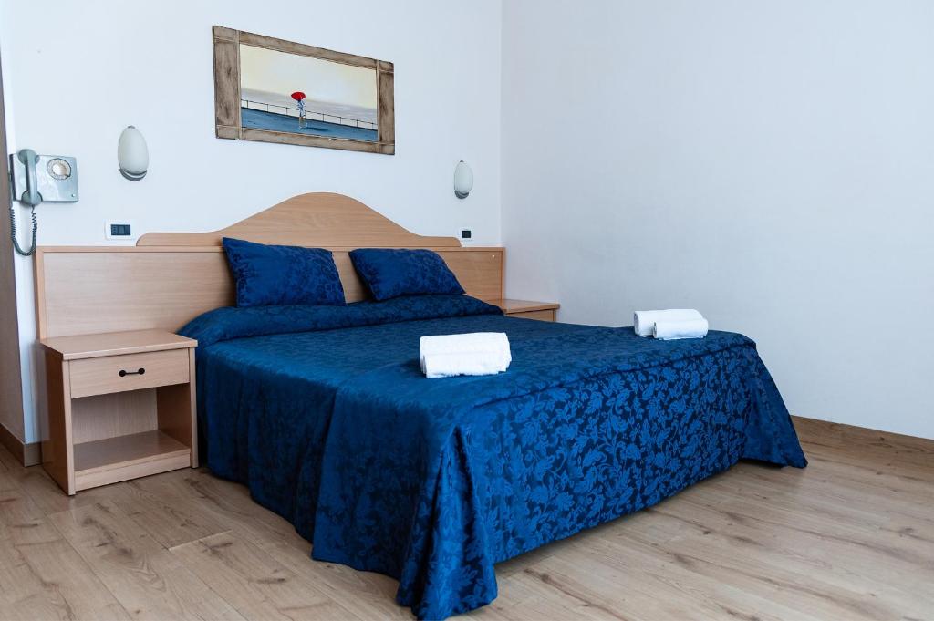 Postel nebo postele na pokoji v ubytování Hotel Mauritius Sentirsi come a Casa
