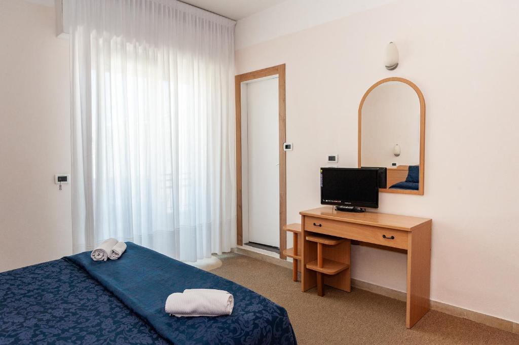 Postel nebo postele na pokoji v ubytování Hotel Mauritius Sentirsi come a Casa