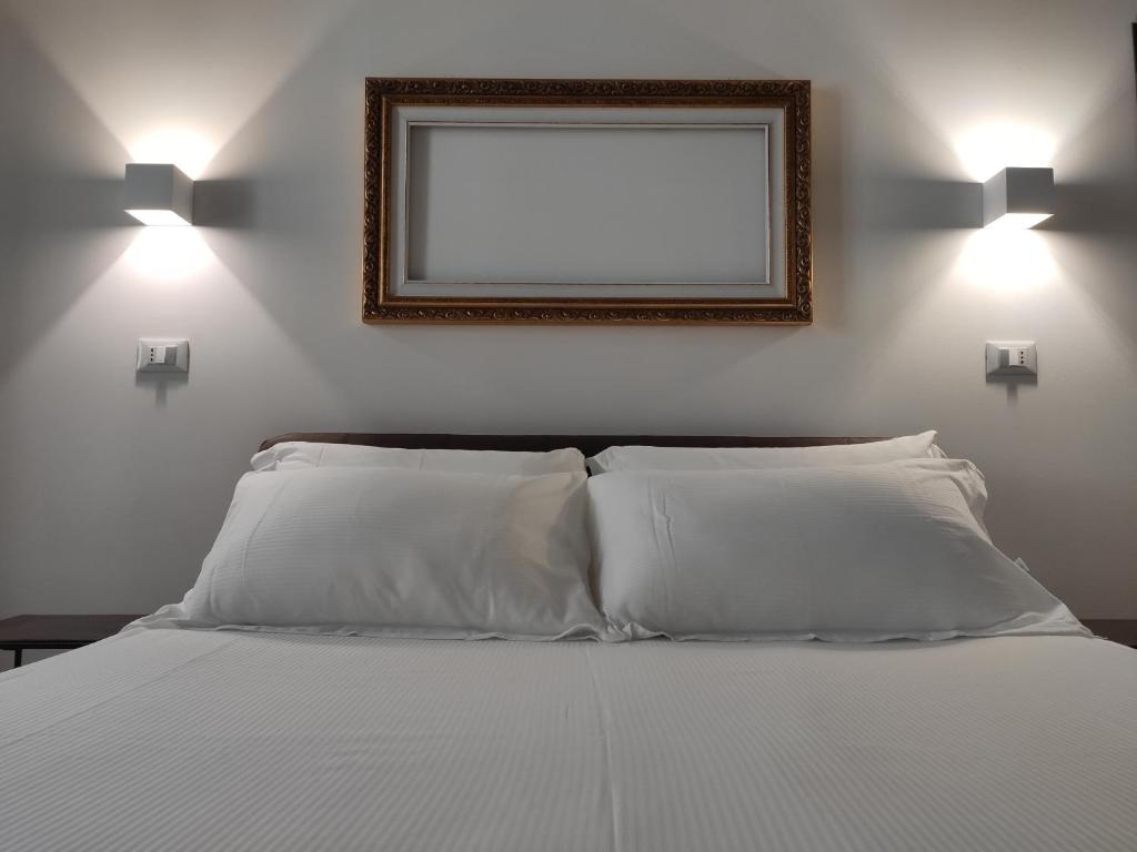 Postel nebo postele na pokoji v ubytování Borgo di Ponte Holiday Apartments & Rooms