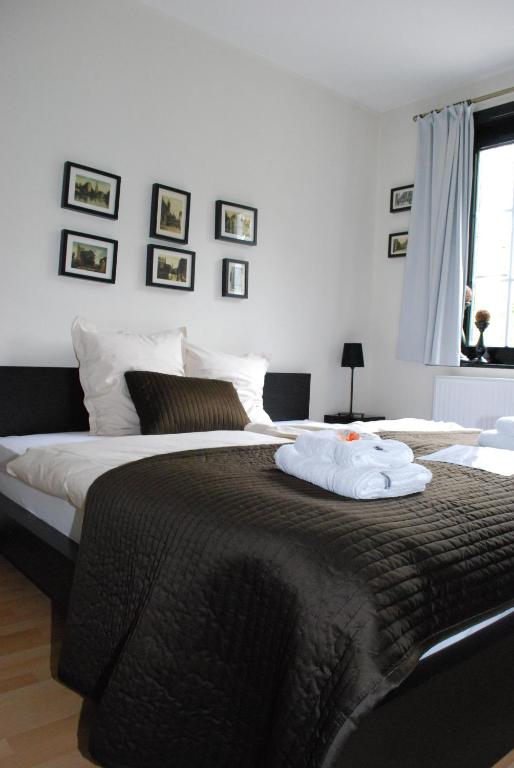 Postel nebo postele na pokoji v ubytování Hotel 'T Bagientje