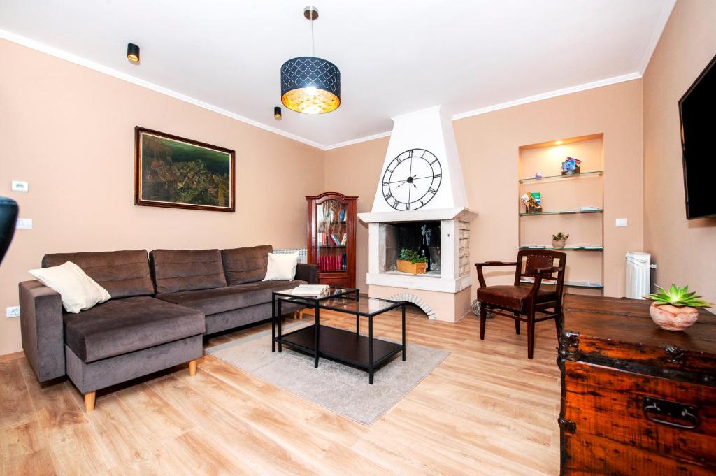 a living room with a couch and a fireplace at Apartment Miral in Rovinjsko Selo