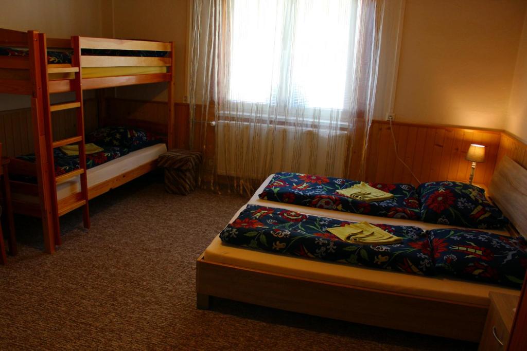 Postel nebo postele na pokoji v ubytování Chata Horec