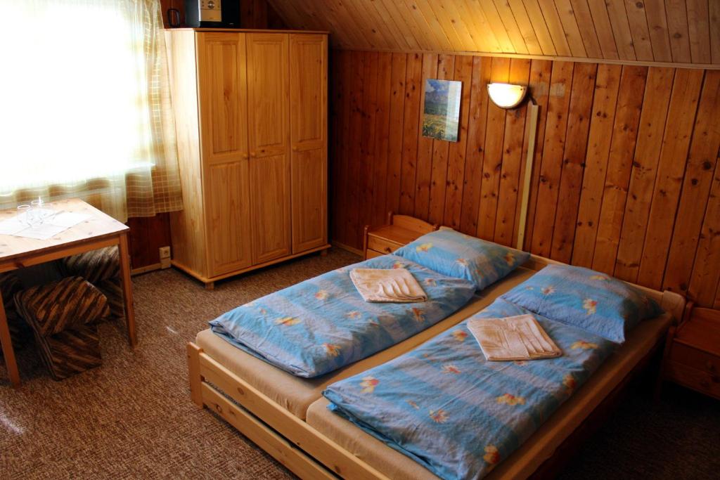Postel nebo postele na pokoji v ubytování Chata Horec