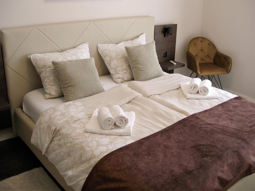 Postel nebo postele na pokoji v ubytování Apartman Neverin