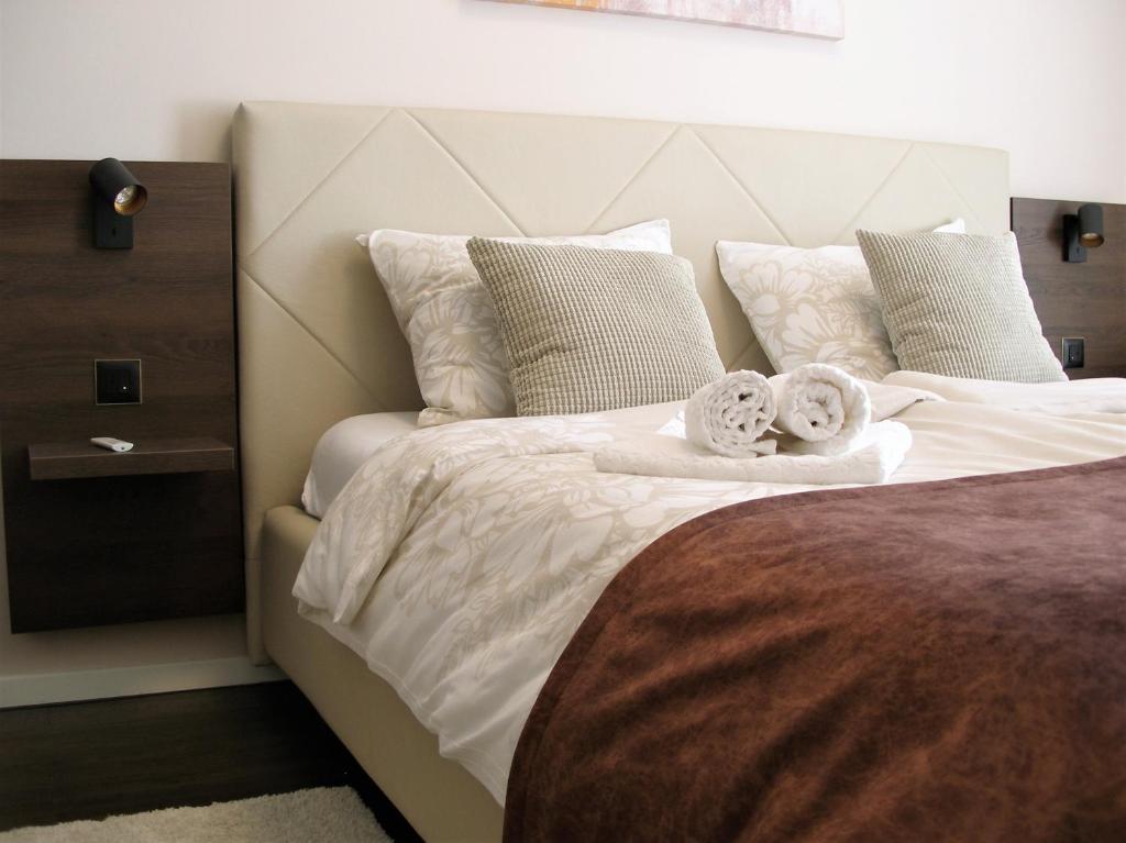 Postel nebo postele na pokoji v ubytování Apartman Neverin