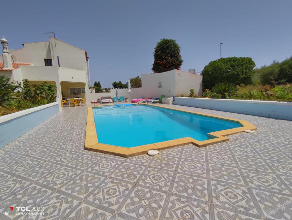 a swimming pool on the roof of a house at Vivenda Diniz in Silves