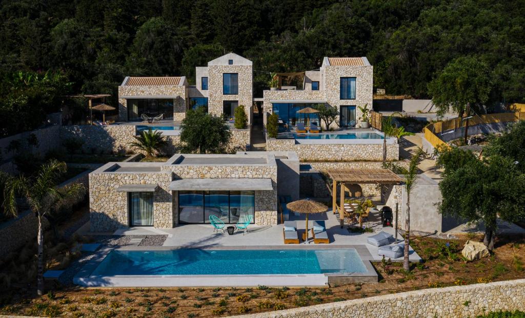 an aerial view of a house with a swimming pool at Mimi and Coco Villas Corfu in Paramonas