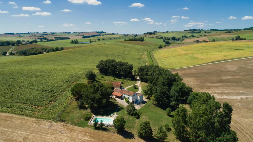 an aerial view of a house in the middle of a field at Maison Lamothe in Flamarens