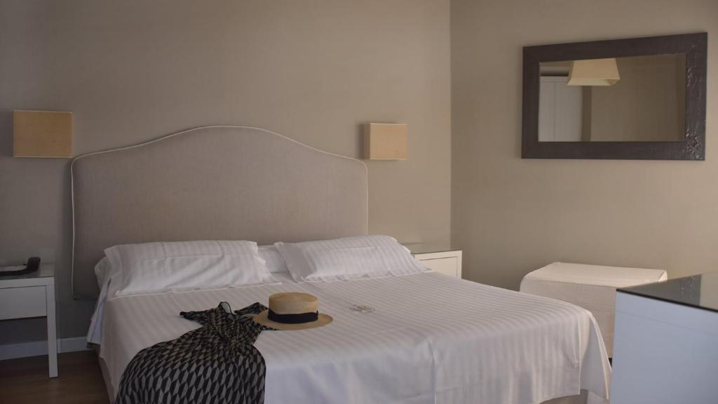 Postel nebo postele na pokoji v ubytování Hotel Ril