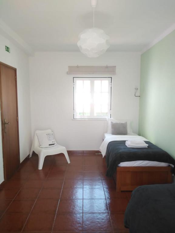 Postel nebo postele na pokoji v ubytování Ergobeach House
