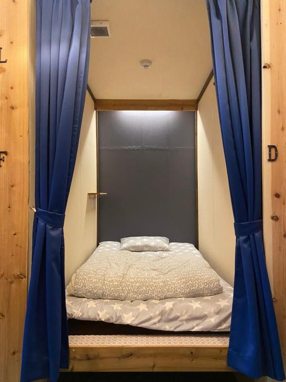 Postel nebo postele na pokoji v ubytování Hostel Furoya