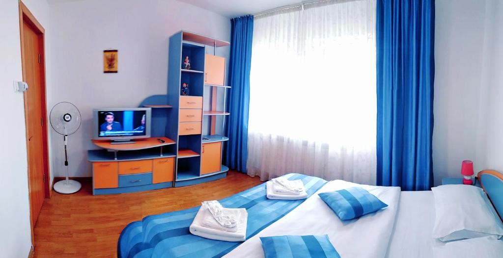 Llit o llits en una habitació de Laguna Apartment