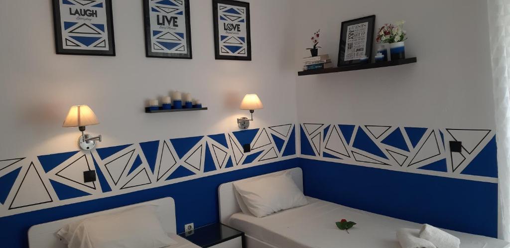 Postel nebo postele na pokoji v ubytování Villa Tasos