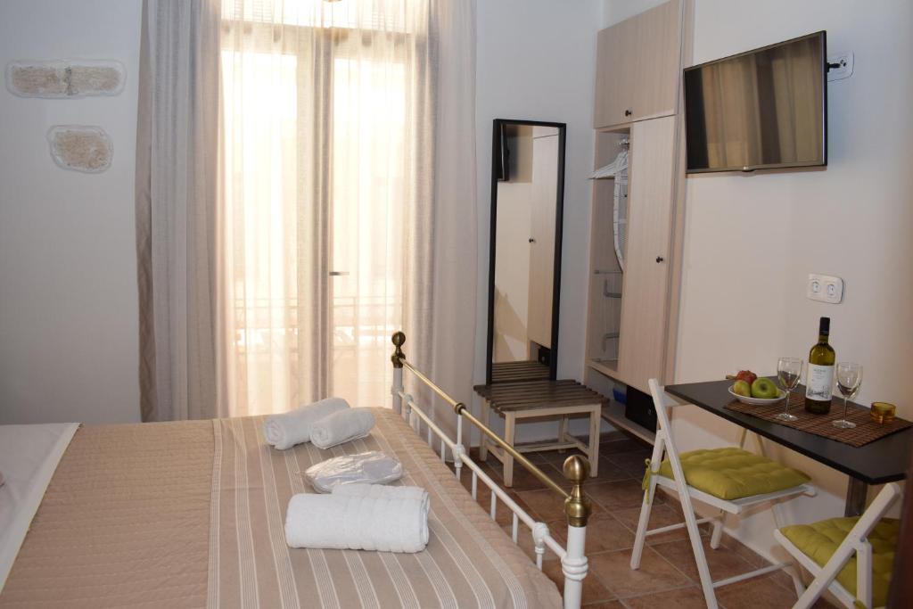 Posteľ alebo postele v izbe v ubytovaní Loggia Traditional Suites