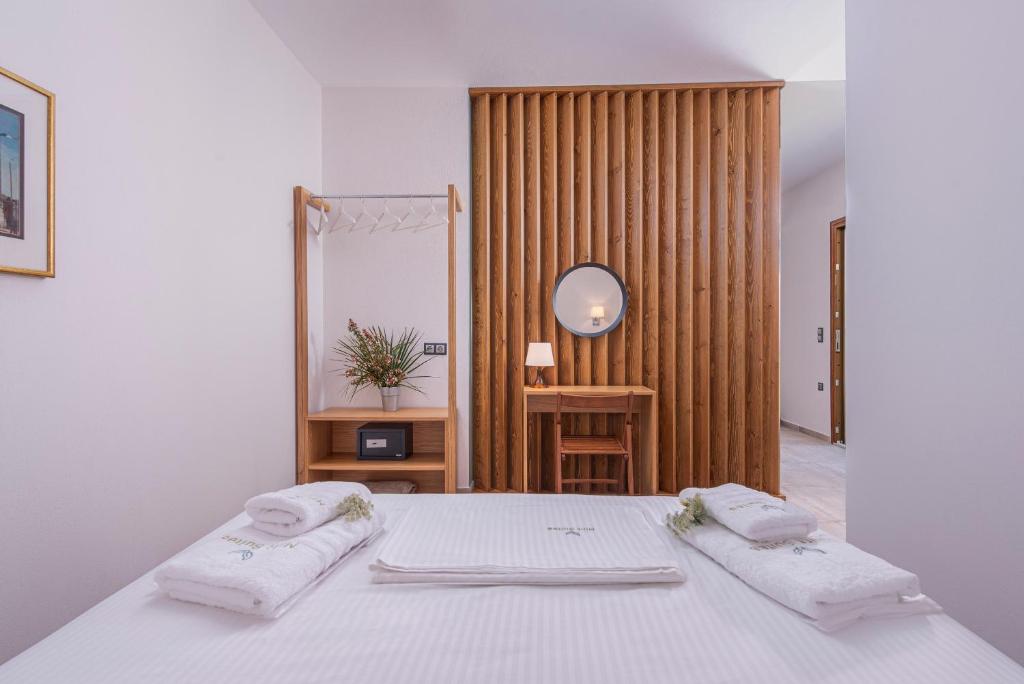 Postel nebo postele na pokoji v ubytování Mint Retreat Suites