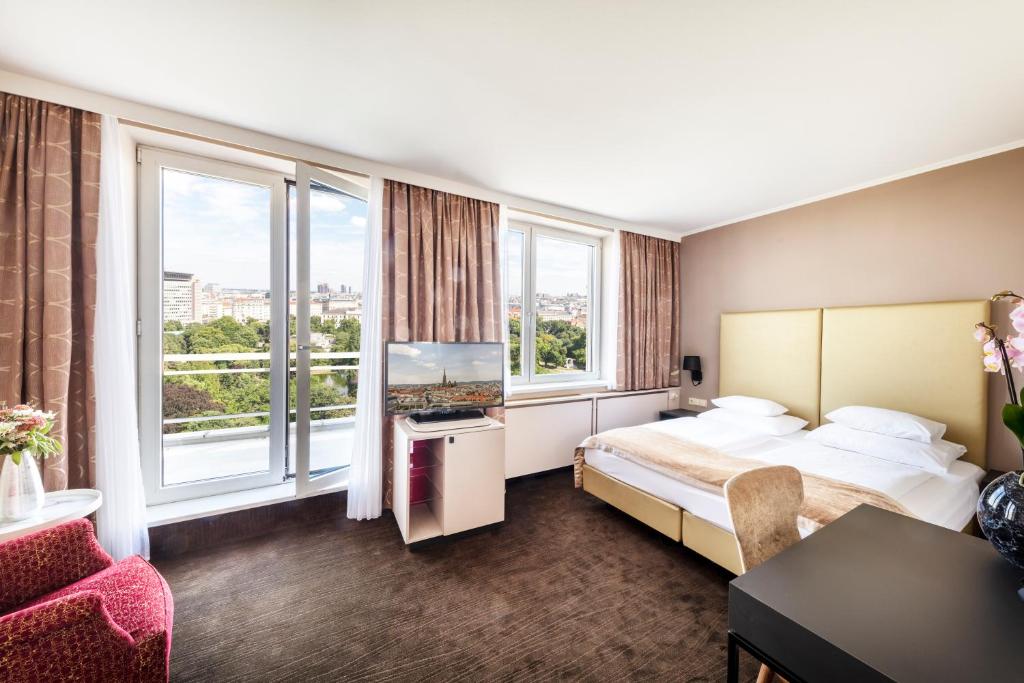 Voodi või voodid majutusasutuse Hotel Am Parkring toas