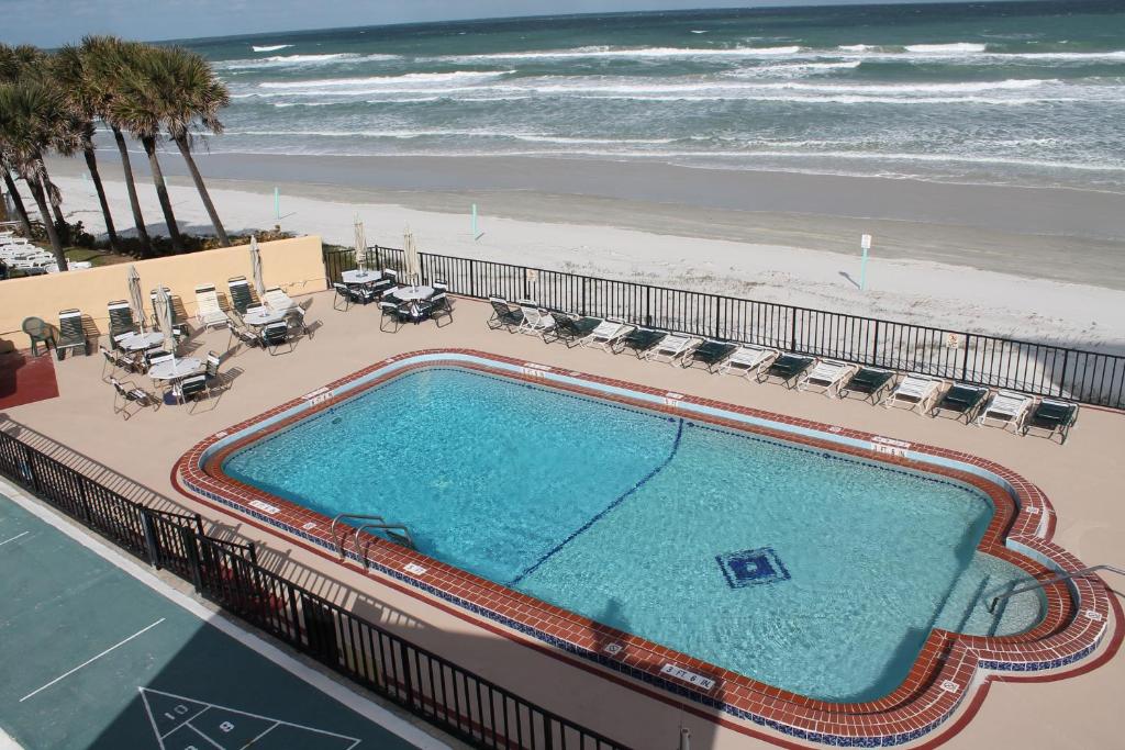 an overhead view of a swimming pool and the beach at Grand Prix Motel Beach Front in Daytona Beach