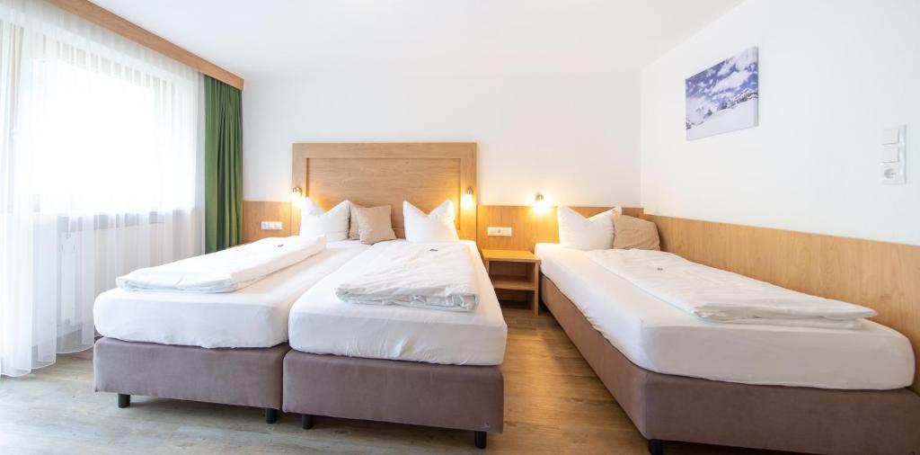 Posteľ alebo postele v izbe v ubytovaní Appartements Waldesrand
