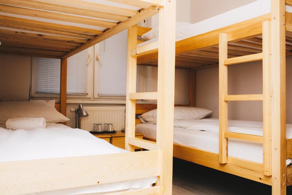 Postel nebo postele na pokoji v ubytování Bloom Inn