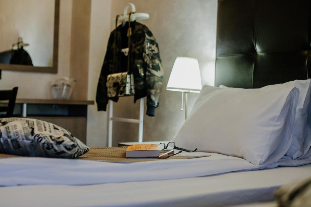Postel nebo postele na pokoji v ubytování Hotel Fontana