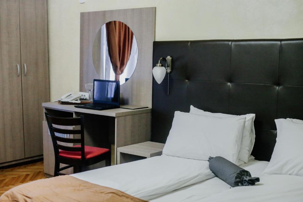 Postel nebo postele na pokoji v ubytování Hotel Fontana
