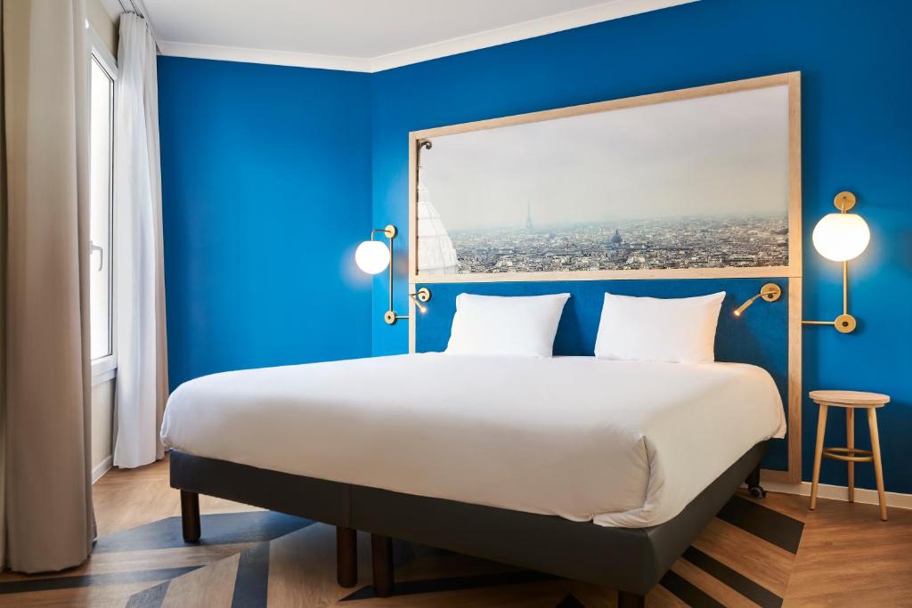 Postel nebo postele na pokoji v ubytování Aparthotel Adagio Porte de Versailles