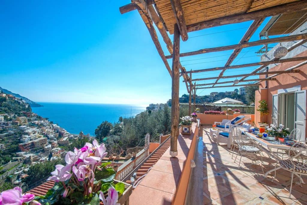 a house with a balcony with a view of the ocean at Casa della Nonna in Positano