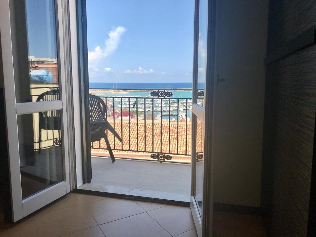 a view of a balcony with a view of the beach at Castellammare Smart Rooms in Castellammare del Golfo