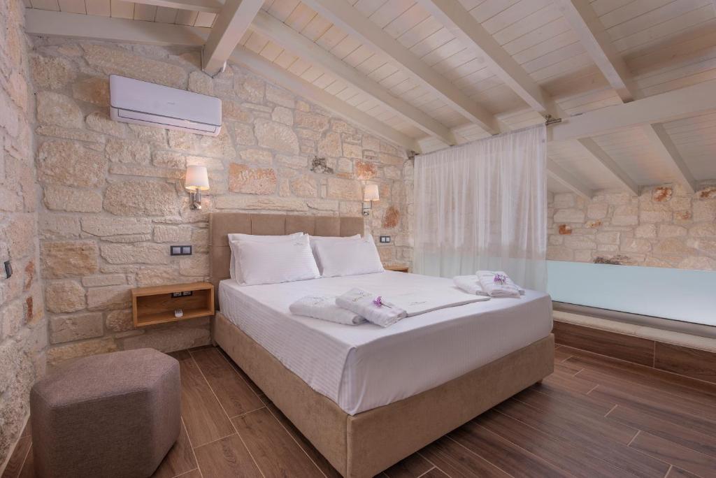 Postel nebo postele na pokoji v ubytování Mint Retreat Suites