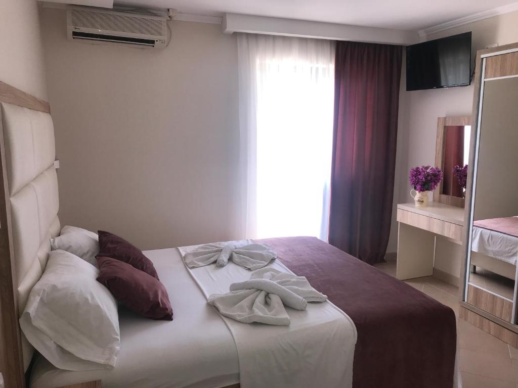 Postel nebo postele na pokoji v ubytování Apartments Ada Bojana
