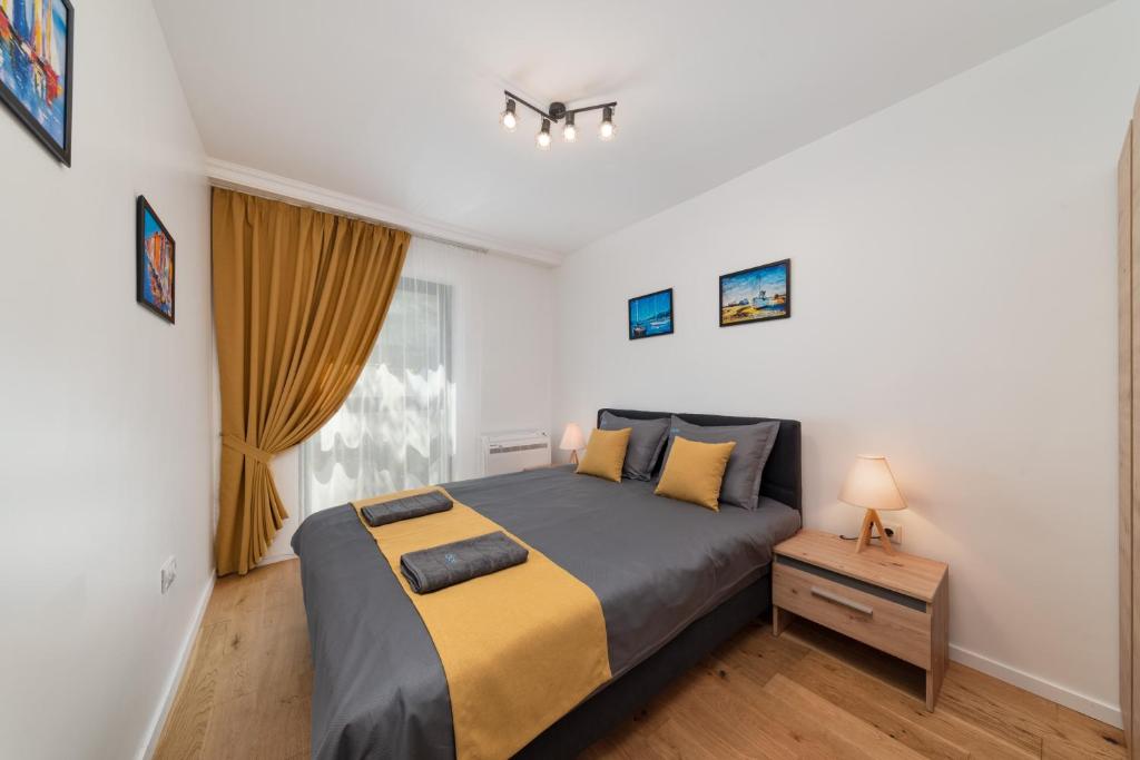 Ένα ή περισσότερα κρεβάτια σε δωμάτιο στο Varna Smart Home Apartments