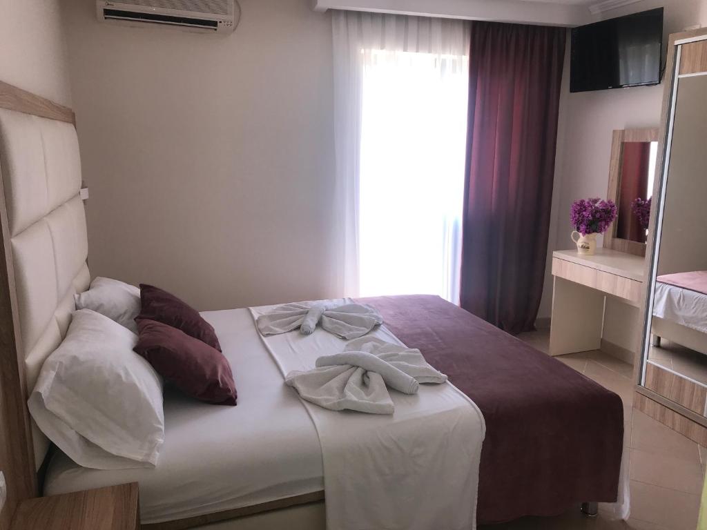 Postel nebo postele na pokoji v ubytování Apartments Ada Bojana