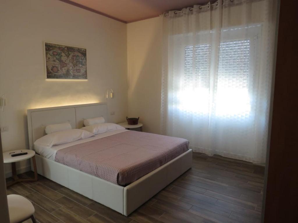 Postel nebo postele na pokoji v ubytování B&b Angolo 29