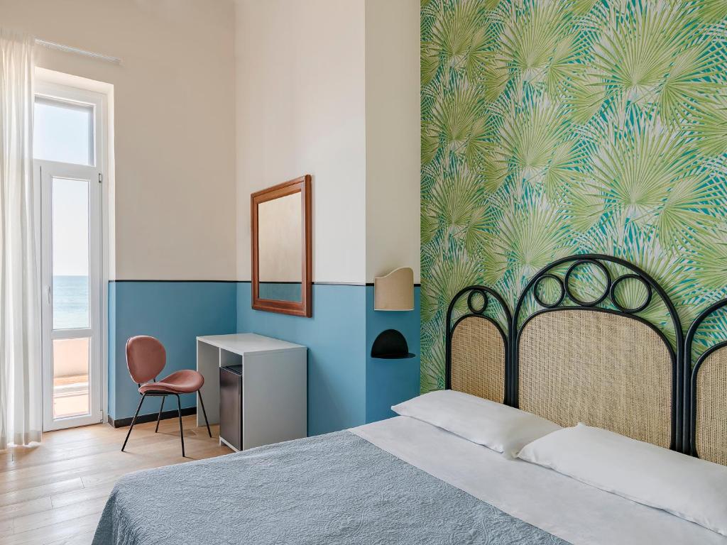 Postel nebo postele na pokoji v ubytování Hotel Riviera