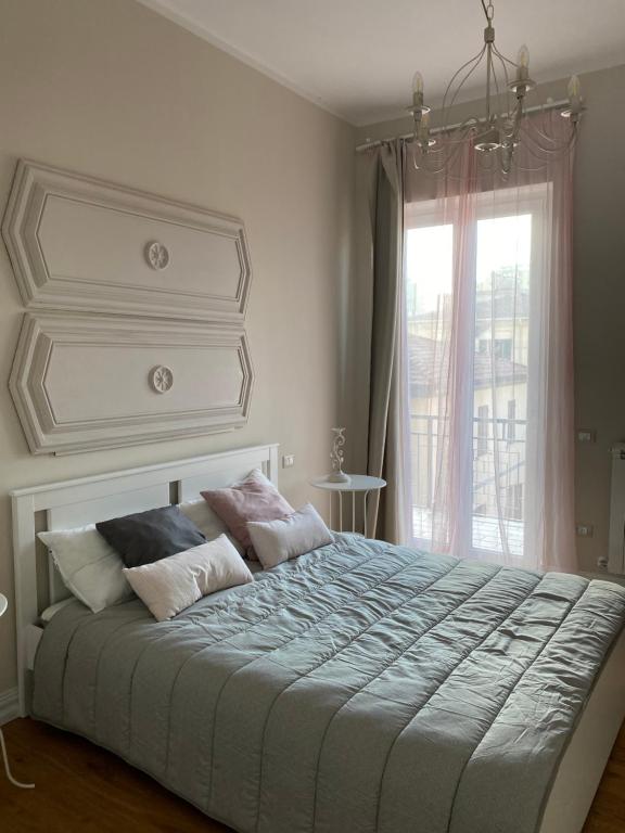 Postel nebo postele na pokoji v ubytování Affittacamere VIA ROMA 12