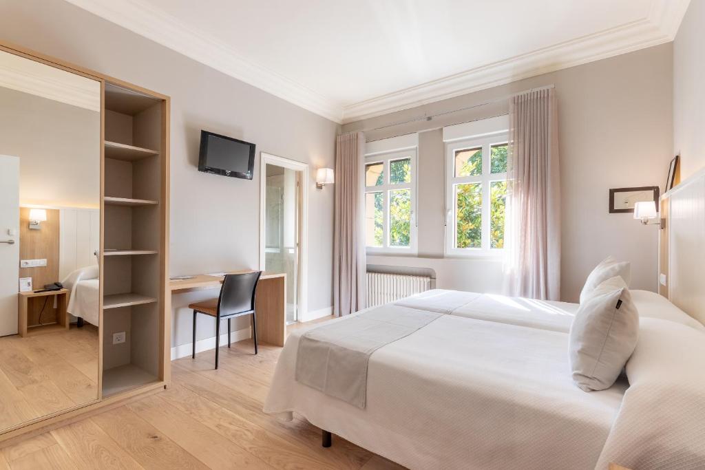 Postel nebo postele na pokoji v ubytování Hotel Artaza