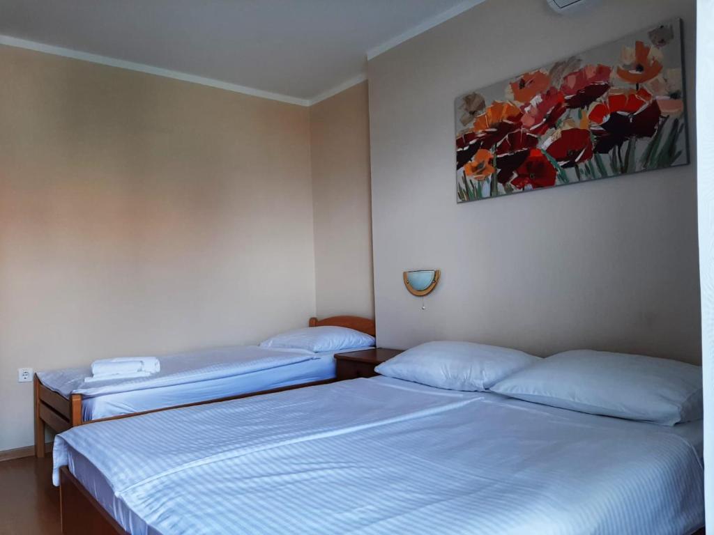Postel nebo postele na pokoji v ubytování Guest House Katarina